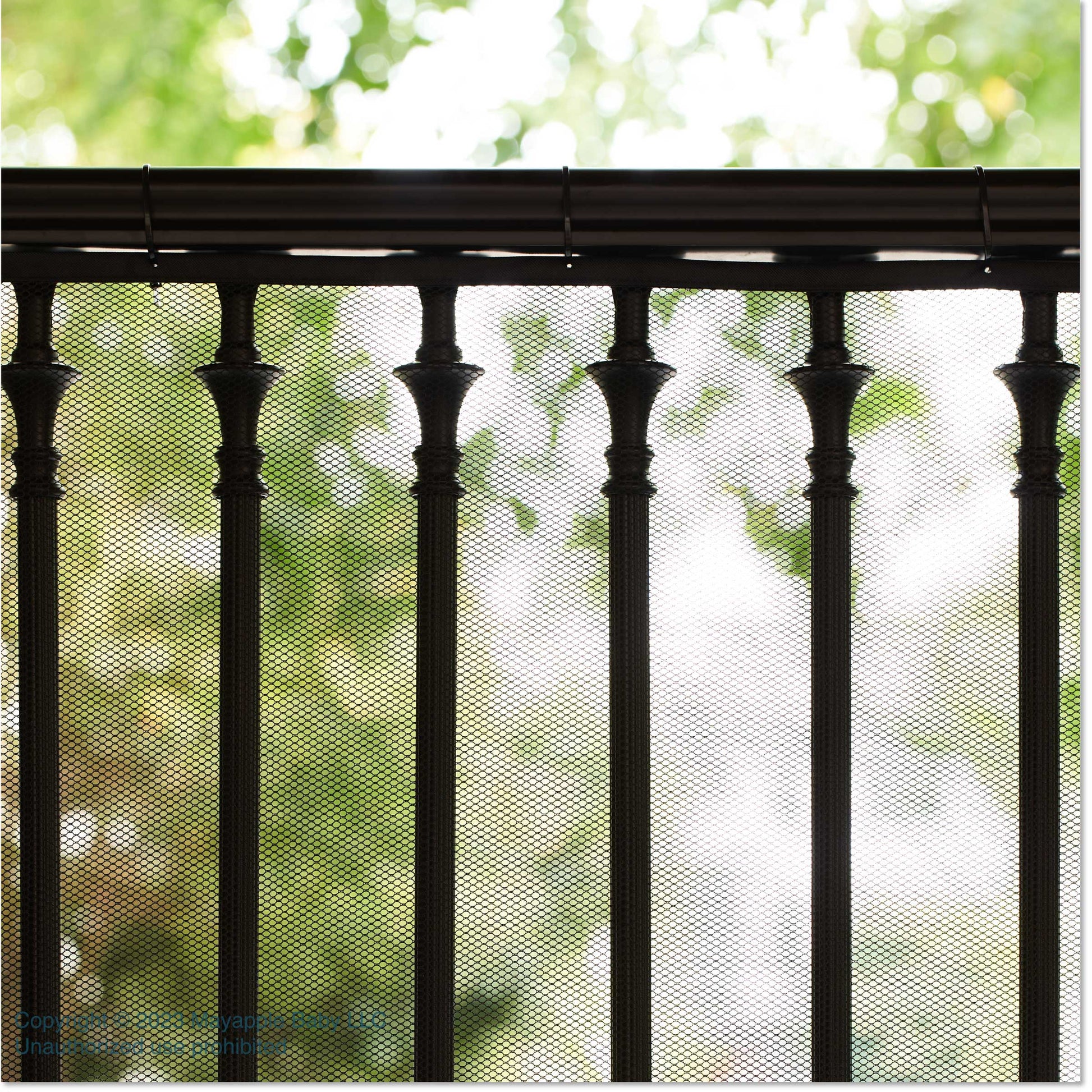 Roving Cove Indoor and Outdoor Banister Guard and Railing Safety Net for baby proofing stairway railing, deck, patio, balcony and beyond. Keep your babies, pets and toys from falling through banisters. Available on Amazon. 